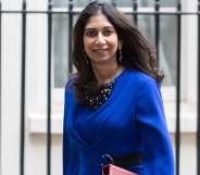 Suella Braverman leaving Downing Street wearing a blue blouse.