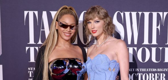 Beyoncé and Taylor Swift stand next to one another at the Taylor Swift: The Eras Tour film premiere.