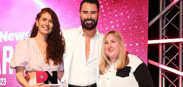 Rylan presents Contiki with the Travel and Hospitality Award at the PinkNews Awards 2023. (PinkNews)