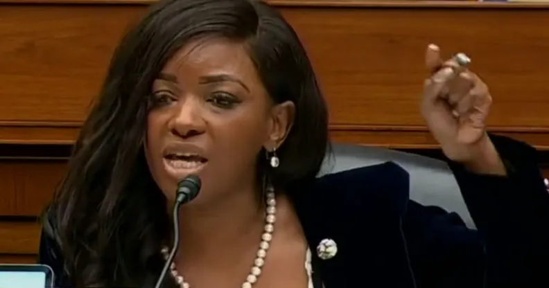 Jasmine Crocket raising her finger to enunciate a point during her speech at a Capitol Hill hearing.