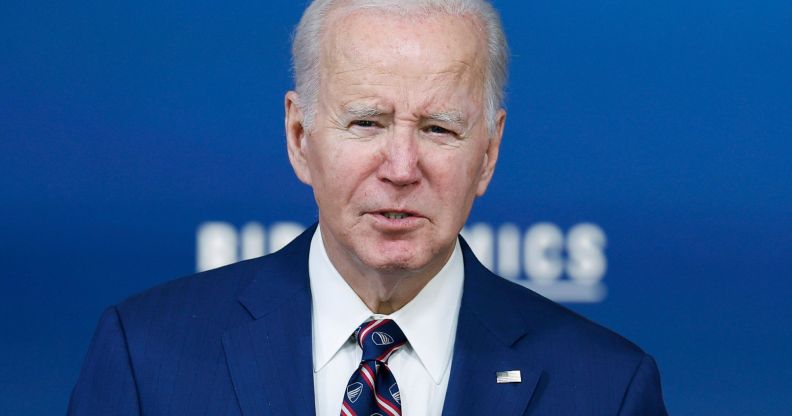 A shoulder-height picture of Joe Biden on stage of a Bidenomics conference.