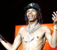 Lil Baby performs topless at 2022 Something In The Water Music Festival.