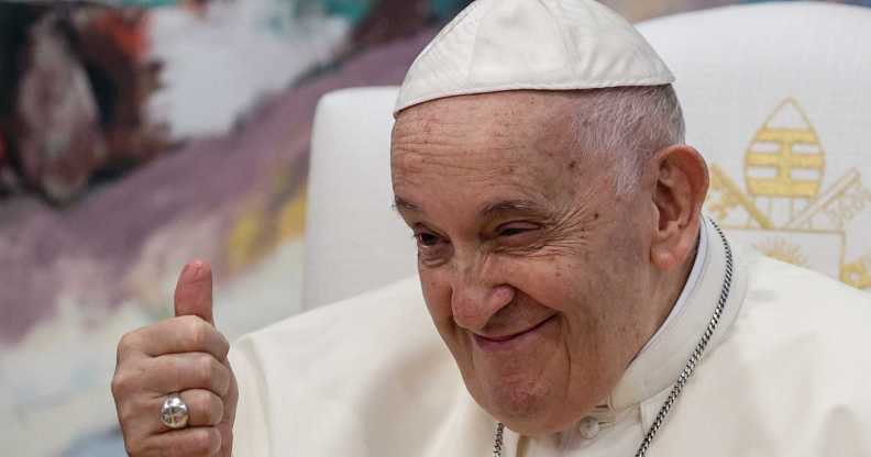 Pope Francis smiles while giving a thumbs up
