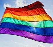 Stock image of a rainbow flag waving