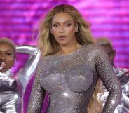 Beyoncé in a silver sparkling bodysuit performing on the Renaissance Tour.