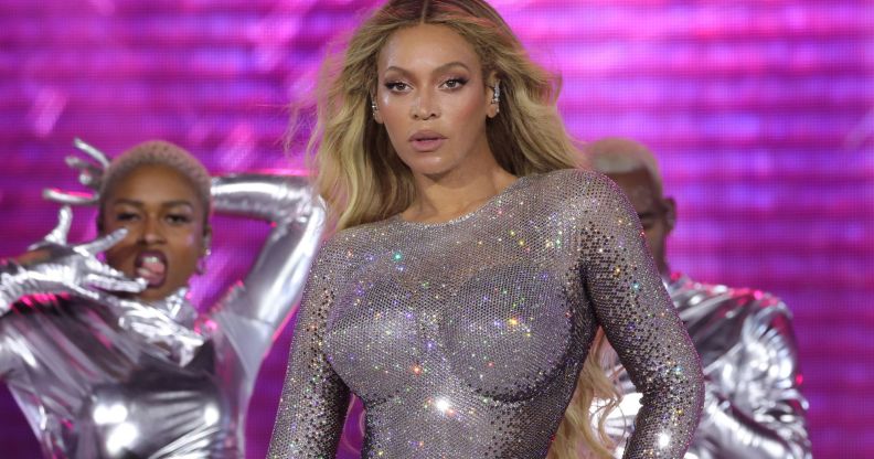 Beyoncé in a silver sparkling bodysuit performing on the Renaissance Tour.