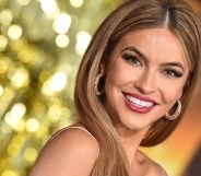 Selling Sunset star Chrishell Stause smiling on a red carpet