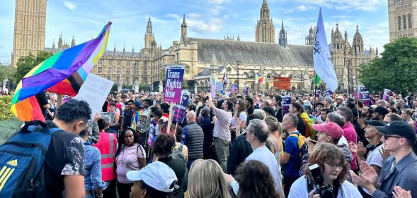 Crowds gathering outside Parliament Square during the Stand Against Suella protest.