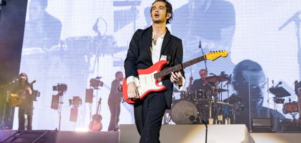 The 1975 frontman Matty Healy performing on stage