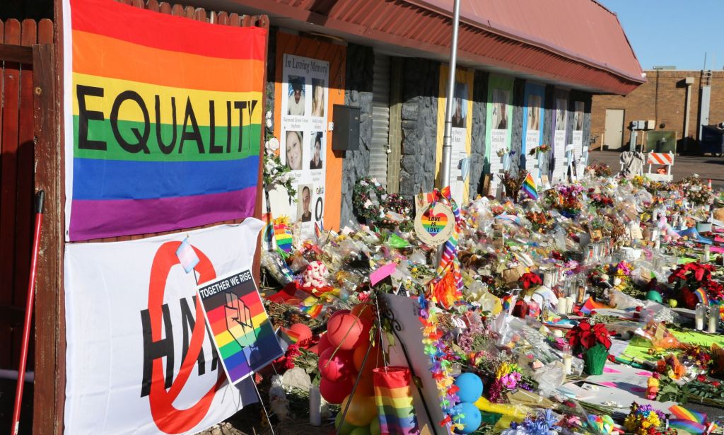A pride flag reading "Equality" and hundreds of items adorn the closed entrance to Club Q. The Club Q shooting memorial continues growing one week after a mass shooter took five lives and injured 18 others on Nov. 19 at an LGBTQ club in Colorado Springs.