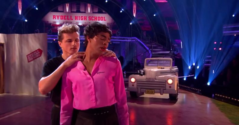 Layton Williams performs in a pink and black drag look for a Grease-inspired dance on Strictly Come Dancing