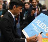 Rishi Sunak signing a pledge with LGBT+ Conservatives.