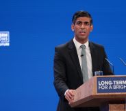 UK prime minister Rishi Sunak wears a suit and tie as he makes a speech at the Conservative Party conference. The prime minister and UK government have been criticised for making anti-trans remarks and failing to tackle LGBTQ+ hate crimes in the country
