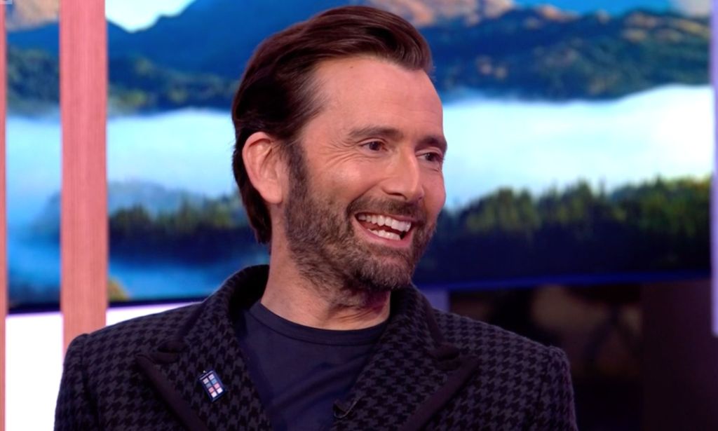 David Tennant on BBC's The One Show wearing a trans pride TARDIS badge.