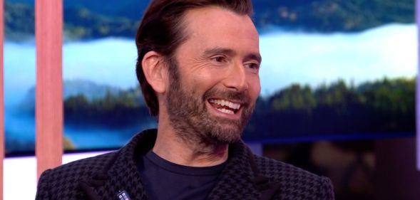 David Tennant on BBC's The One Show wearing a trans pride TARDIS badge.