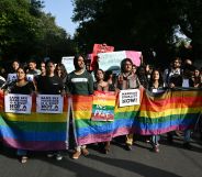 Members of the Student Federation of India (SFI) along with LGBTQ+ activists hold placards and shout slogans during a protest march against India's Supreme Court verdict on same-sex marriage, in New Delhi on October 18, 2023.
