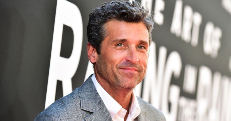 Patrick Dempsey, the Sexiest Man Alive, in a grey suit jacket and white shirt, smiling.