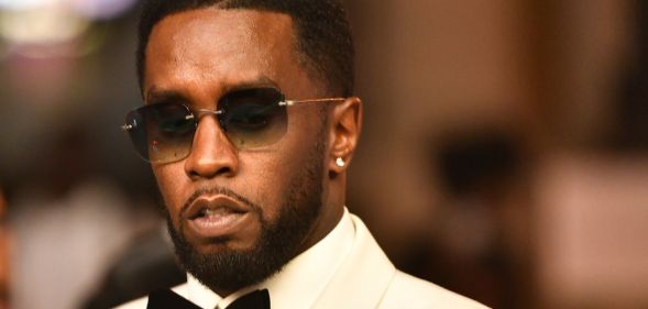Sean Diddy Combs wearing a pair of sunglasses during an event.