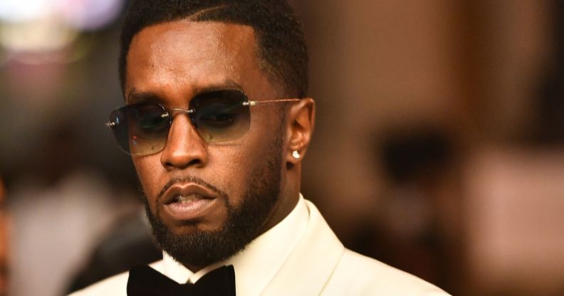 Sean Diddy Combs wearing a pair of sunglasses during an event.