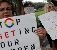 MIAMI, FLORIDA - JUNE 01: (L-R) Marlene (did not want to provide last name) and Jill Dahne protest outside of a Target store on June 01, 2023 in Miami, Florida. The protesters were reacting to Pride Month merchandise featuring the rainbow flag in support of the rights of the lesbian, gay, bisexual, transgender, and queer communities that had been sold at Target stores. Target removed certain items from its stores and made other changes to its LGBTQ+ merchandise after a backlash from some customers. (Photo by Joe Raedle/Getty Images)