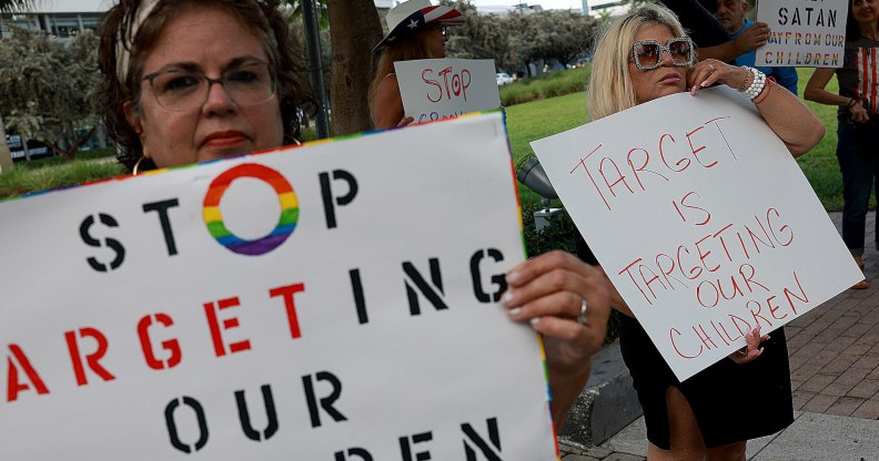 MIAMI, FLORIDA - JUNE 01: (L-R) Marlene (did not want to provide last name) and Jill Dahne protest outside of a Target store on June 01, 2023 in Miami, Florida. The protesters were reacting to Pride Month merchandise featuring the rainbow flag in support of the rights of the lesbian, gay, bisexual, transgender, and queer communities that had been sold at Target stores. Target removed certain items from its stores and made other changes to its LGBTQ+ merchandise after a backlash from some customers. (Photo by Joe Raedle/Getty Images)