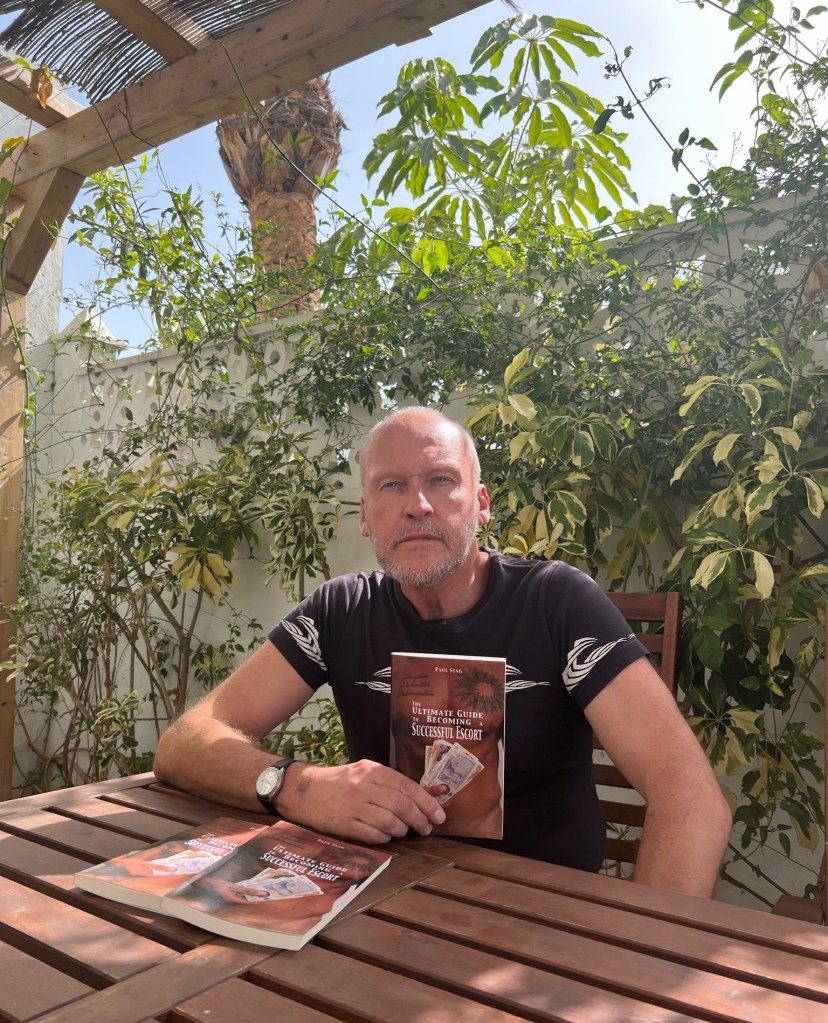 Paul Stag with a copy of his new escorting guide.