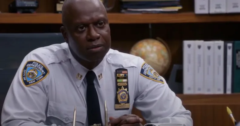 A still screenshot of Andrew Braugher wearing a police uniform while playing the Brooklyn Nine-Nine (also stylised Brooklyn 99) character Captain Raymond Holt