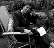 Children's writer Enid Blyton (1897 - 1968) sitting in her garden in Beaconsfield, Buckinghamshire