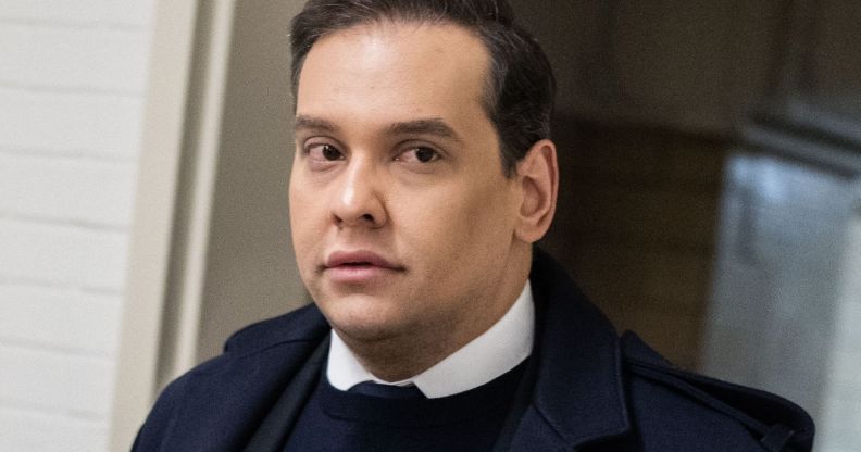 George Santos walking towards the US Congress chambers.