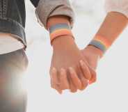 LGBTQ+ couple holding hands