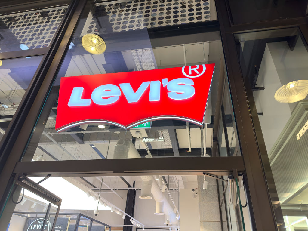 This is an image of a Levi's store. Their iconic logo is in center frame
