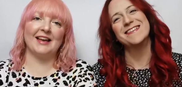 Zoey (right) and Kelly (left), pictured smiling.