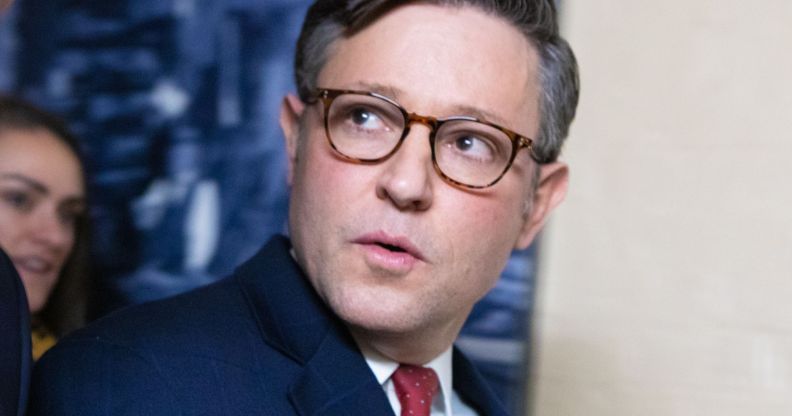 Mike Johnson, pictured walking through a government building.