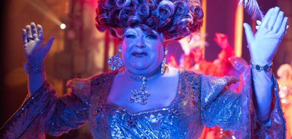 A drag performer in a Pantomime outfit.