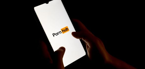Stock image of the PornHub app on a phone