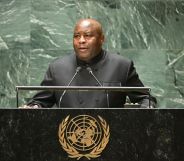 Burundi's president Evariste Ndayishimiye, who recently said LGBTQ+ people 'should be stoned', stands at a podium as he speaks into a microphone