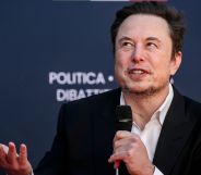 Elon Musk wears a white shirt and black jacket as he speaks about why people should have more babies at a right-wing event in Italy