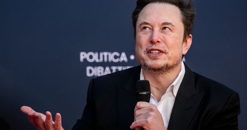 Elon Musk wears a white shirt and black jacket as he speaks about why people should have more babies at a right-wing event in Italy