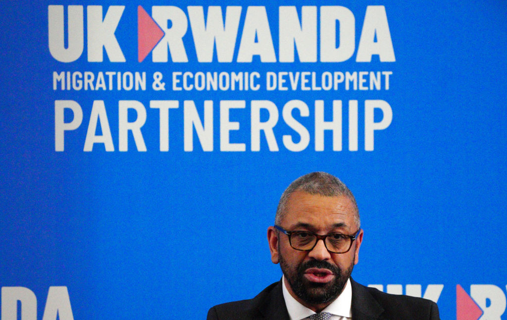 Britain's Home Secretary James Cleverly speaks during a joint press conference with his Rwanda's Foreign Minister after signing a new treaty, in Kigali on December 5, 2023.