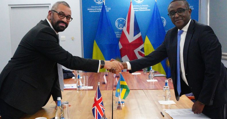 British Home Secretary James Cleverly (L) and Rwandan Minister of Foreign Affairs Vincent Biruta hold a bilateral meeting after they signed a new treaty with Rwanda on December 5, 2023 in Kigali, Rwanda. The treaty will address concerns by the Supreme Court, including assurances that Rwanda will not remove anybody transferred under the partnership to another country.