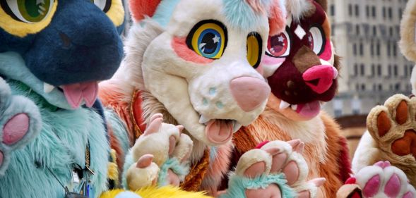 A group of people dress up as anthropomorphic animals, aka furries, in an illustration for an article about LGBTQ+ protests