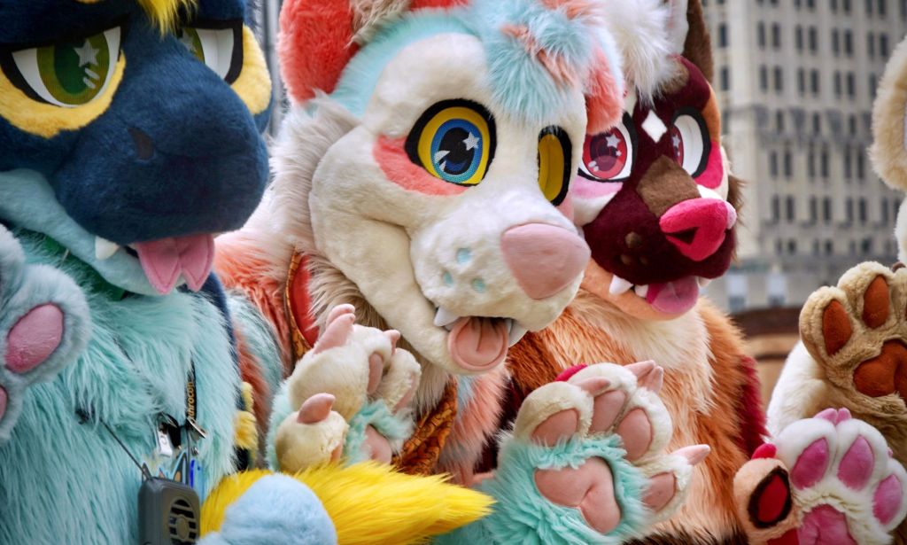 A group of people dress up as anthropomorphic animals, aka furries, in an illustration for an article about LGBTQ+ protests 