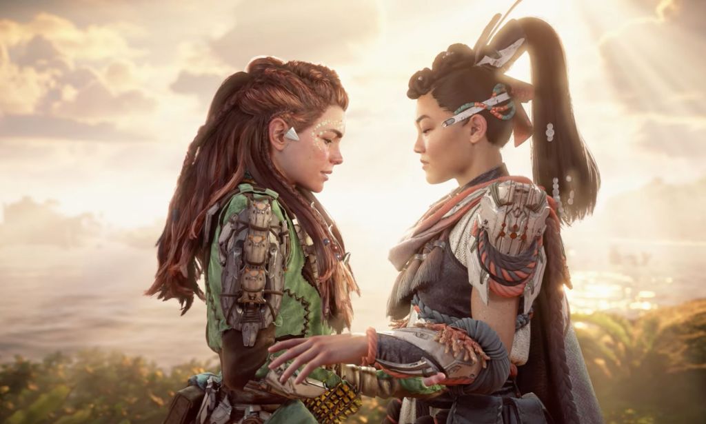 A screenshot from the Horizon Forbidden West Burning Shores video game of LGBTQ+ character Aloy standing arm in arm with another female character who she kissed