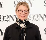 American actress Annette Bening wearing black coat and black-and-white scarf