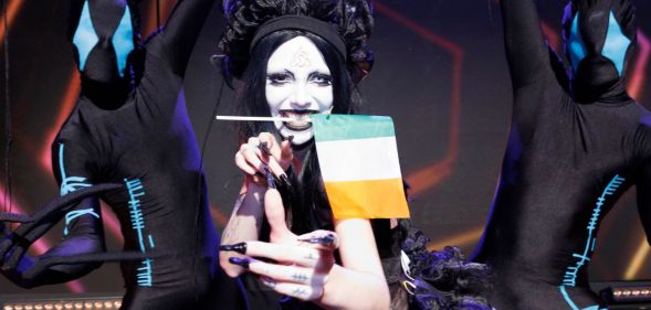 Bambie Thug performing with the Ireland flag in their mouth.