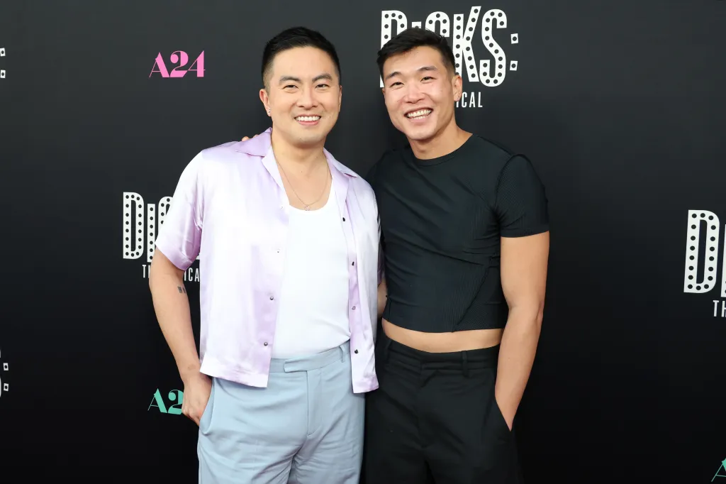Bowen Yang and Joel Kim Booster posing at a film premiere.