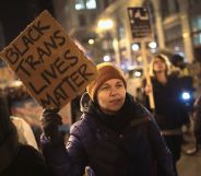 Protester holds up sign reading "black trans lives matter"