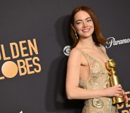 Emma Stone poses with the award for Best Performance by a Female Actor in a Motion Picture - Musical or Comedy for her performance in Poor Things