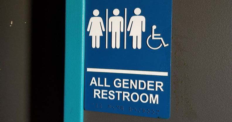 Stock image of a gender-neutral toilet door