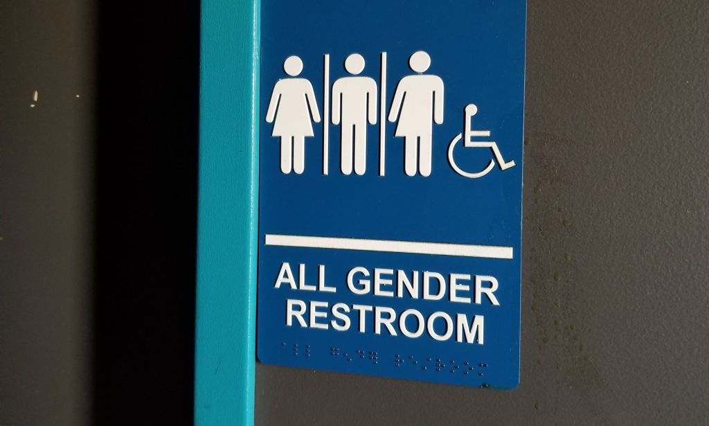 Stock image of a gender-neutral toilet door